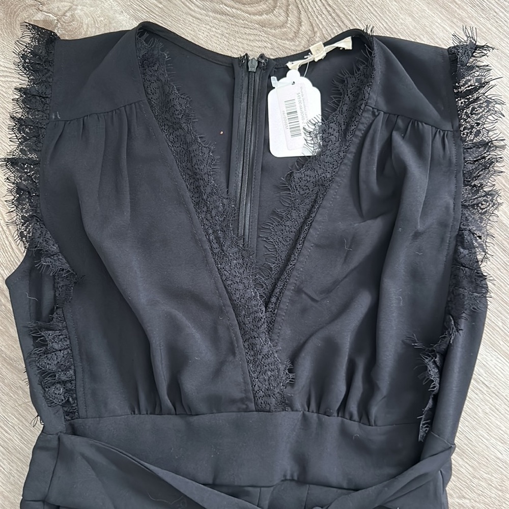 Black pleated front romper with lace trim sleeves and neck line - Picture 2 of 10
